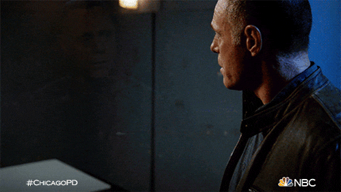 a man sits at a table with a glass of water in front of him with the hashtag #chicagopd on the bottom