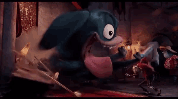 a person is being hit with a sword in a room .