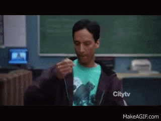 a man in a citytv hoodie is eating a piece of food