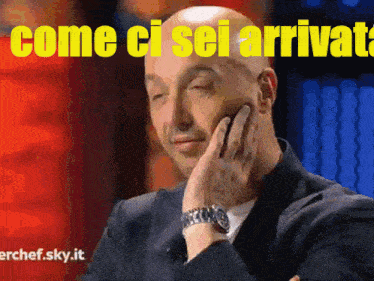 a man with his hand on his face and the words " come ci sei arrivato " behind him