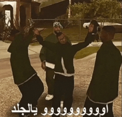 a group of men are dancing in front of a house with arabic writing .