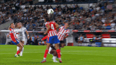 a soccer player wearing a red and white jersey with the number 4 on it