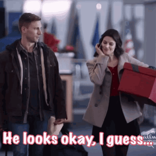 a man and a woman are holding hands and the man says he looks okay i guess