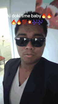 a man wearing sunglasses says ki doki time baby on the top of his head