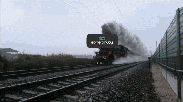 a train going down the tracks with ethernity written on it