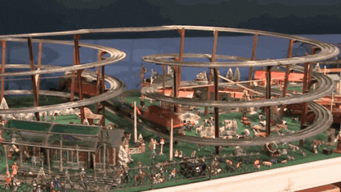 a model of a roller coaster with a lot of people and animals