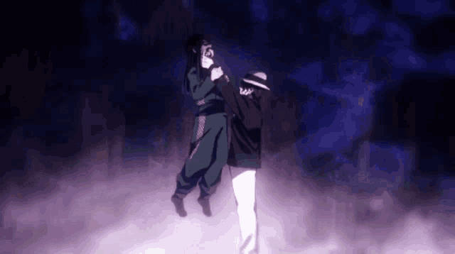 a man and a woman are dancing together in a dark room .