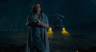 a person is walking up a set of stairs in the dark