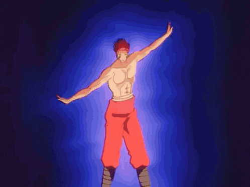 a man in red pants is standing in a dark room