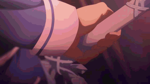 a close up of a person holding a sword in their hand