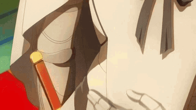 a close up of a person holding a sword .