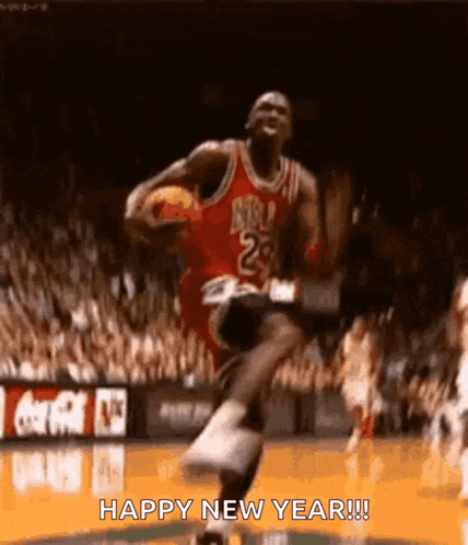 a basketball player is jumping in the air while holding a basketball in his hand .