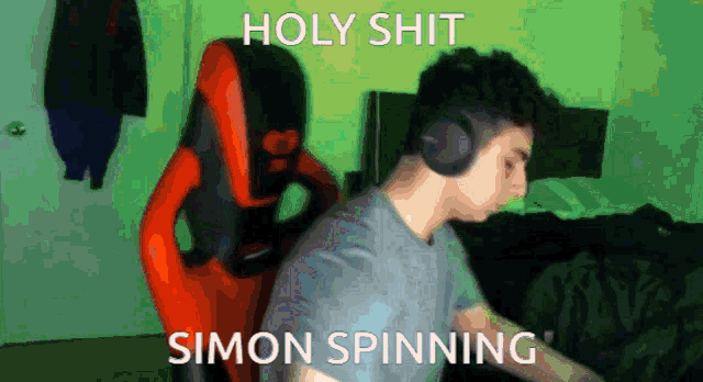 a man wearing headphones with the words holy shit simon spinning