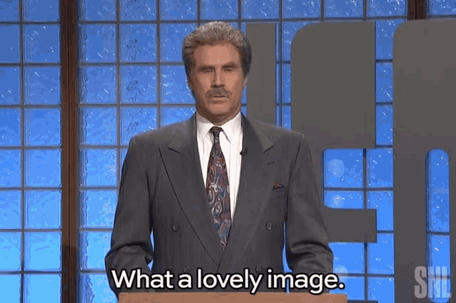 a man in a suit and tie is standing at a podium and says what a lovely image