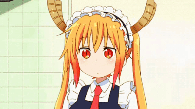a girl with horns on her head is covering her face with her hands
