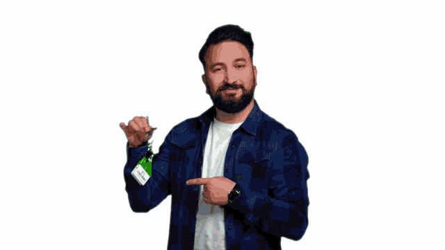 a man in a blue plaid shirt is pointing at his watch and holding a car key