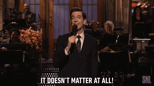a man speaking into a microphone with the words " it does n't matter at all "
