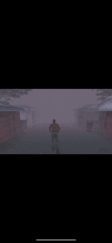 a man is running through the fog in a video game .