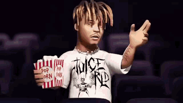 a man is holding a bag of popcorn in a movie theater .