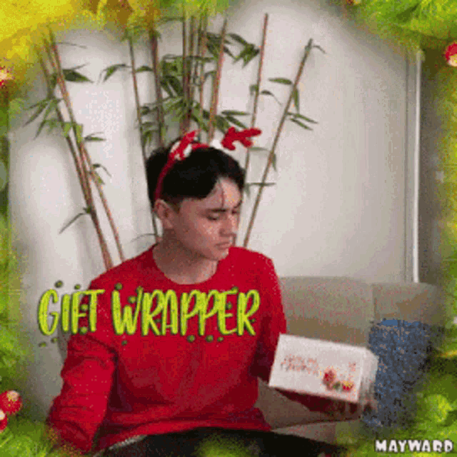 a man wearing a red sweater that says gift wrapper on it