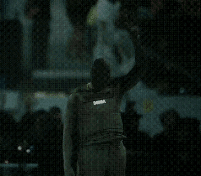 a man wearing a bullet proof vest that says ' georgia ' on it
