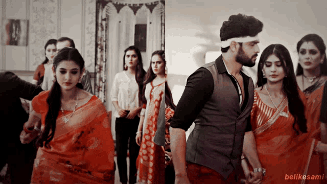 a man with a bandana on his head stands in front of a group of women including one wearing a red saree