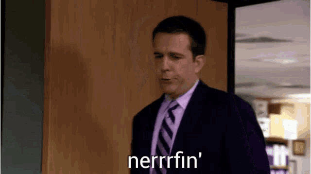 a man in a suit and tie is saying nerrrfin '