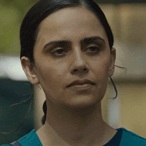 a close up of a woman 's face with her eyes closed