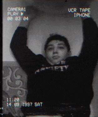 a black and white photo of a person with their arms in the air taken on september 14 1997