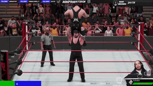 a video game screen shows a wrestling match being played