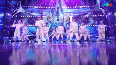 a group of people are dancing on a stage with a sign that says got talent