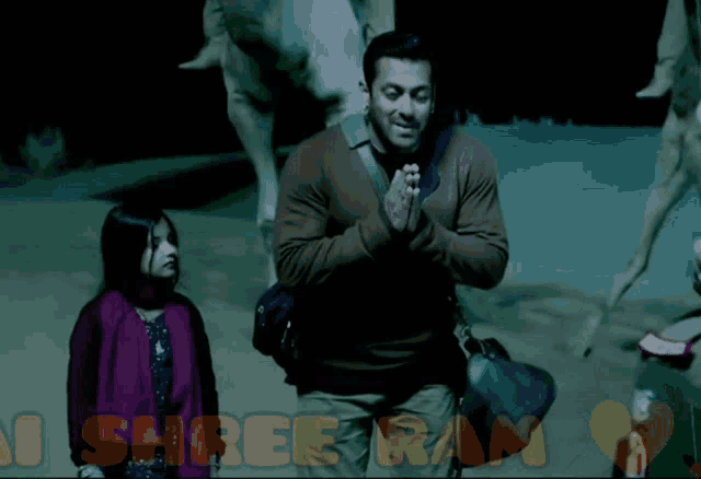 a picture of a man and a little girl with the words jai shree ram in orange letters