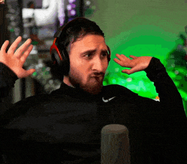 a man wearing headphones and a nike shirt is making a face