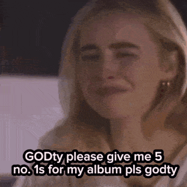 a woman crying with the words godty please give me 5 no. 1s for my album pls godty