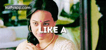 a woman with a bindi on her forehead and the words " like a " on the bottom