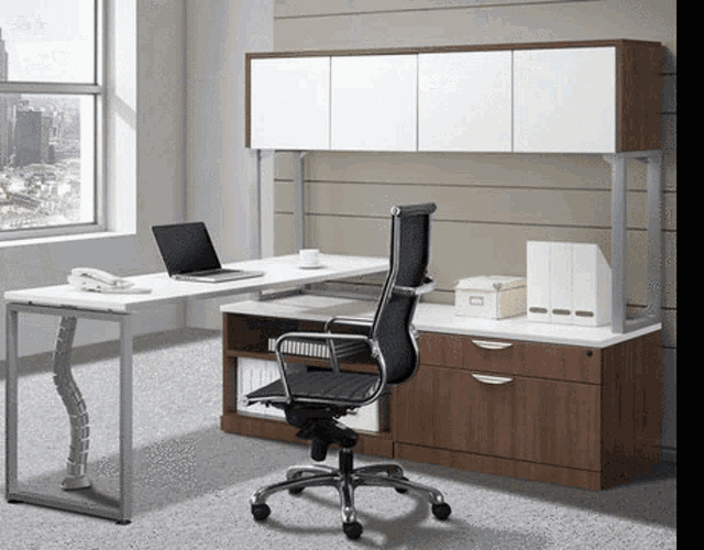 a desk with a laptop on it and a black chair