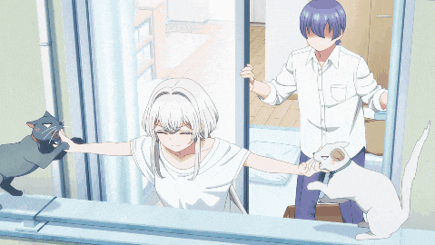 a boy and a girl are playing with a cat