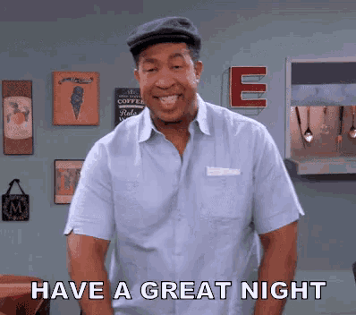 a man says have a great night in front of a sign that says e