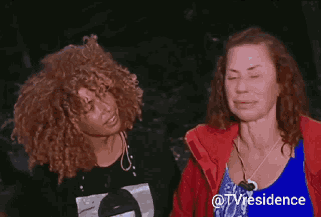 two women with curly hair are standing next to each other with the words @tvresidence behind them