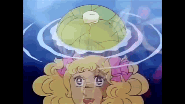 a cartoon girl is holding a ball on her head .