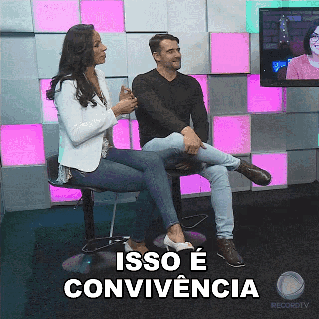 a woman sits on a man 's lap and says " isso e conviencia "