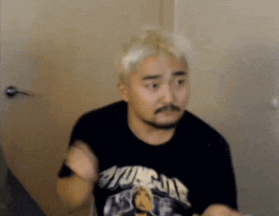 a man with a beard and blonde hair is wearing a black t-shirt with the word yungja on it .