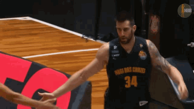 a basketball player wearing a number 34 jersey