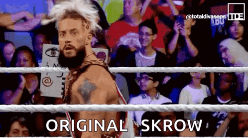a man in a wrestling ring with the words original skrow written on it