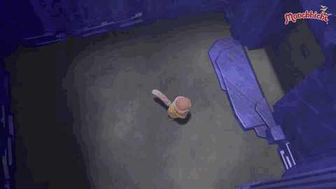 a cartoon character is standing in a dark room in a castle .