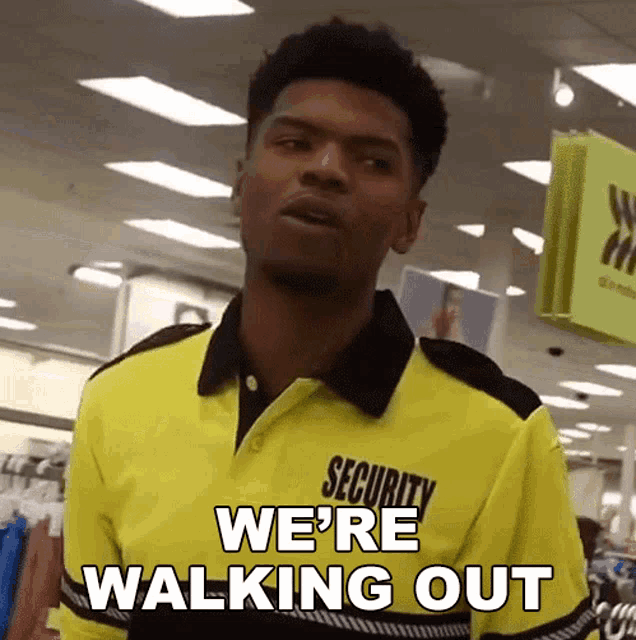 a man wearing a security shirt says we 're walking out