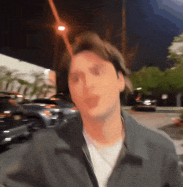 a blurry picture of a man making a funny face