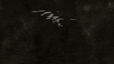 a soccer game is being played in a dark stadium with a banner that says ' fc barcelona ' on it