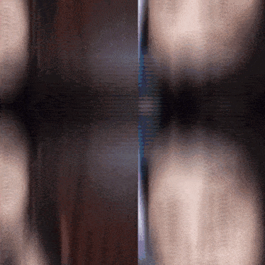 a blurred image of a person 's face and a blurred image of a person 's torso