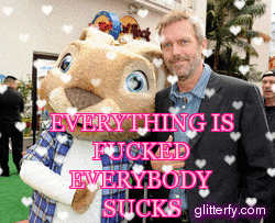 a man in a suit stands next to a stuffed animal that says everything is fucked everybody sucks